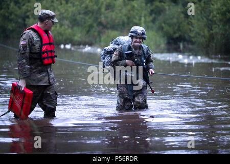 U.S. Army Reserve Sgt. James Southard, a petroleum supply specialist with the 786th Quartermaster Company, 79th Theater Sustainment Command, competes in the ruck march event at the 2018 U.S. Army Reserve Best Warrior Competition at Fort Bragg, North Carolina, June 12, 2018, June 12, 2018. The grueling, multifaceted competition evaluated U.S. Army Reserve Soldiers in the ruck march, the Excellence in Competition pistol range, the German Armed Forces Proficiency Badge and several other events with more challenges to come. (U.S. Army Reserve photo by Pfc. Keely Key). () Stock Photo