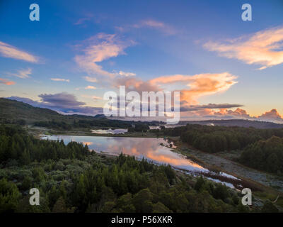The sun rises over the Connemara lakes in Zimbabwe's Eastern Highlands. Stock Photo
