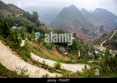 Ha Giang, Vietnam - March 18, 2018: Village surrounded by mountains and fog in the northernmost province of Vietnam Stock Photo