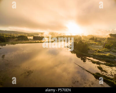 The sun rises over the Connemara lakes in Zimbabwe's Eastern Highlands. Stock Photo