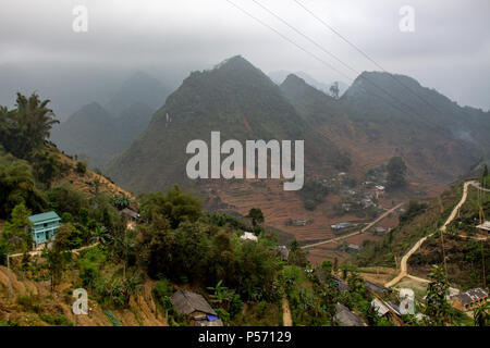 Ha Giang, Vietnam - March 18, 2018: Village surrounded by mountains and fog in the northernmost province of Vietnam Stock Photo