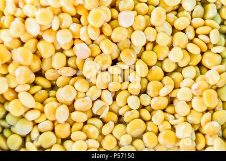 Yellow background made of lupin beans in salted water Stock Photo