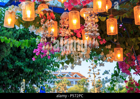 Latern with light under bougainville flowers in Datca, Turkey during summer Stock Photo