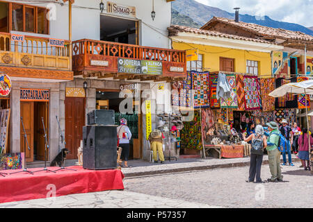 Pisac Peru, tourists and locals shopping in the market Plaza. Stock Photo