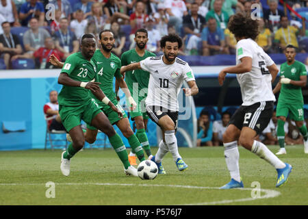 Volgograd, Russia. 25th June, 2018. Egypt's Mohamed Salah (C) vies for the ball during the FIFA World Cup 2018 Group A soccer match between Saudi Arabia and Egypt at the Volgograd Arena in Volgograd, Russia, 25 June 2018. Credit: Ahmed Ramadan/dpa/Alamy Live News Stock Photo