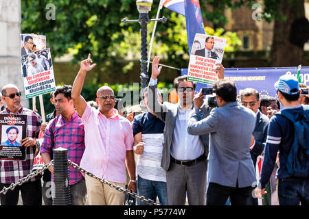 London, United Kingdom - June 25, 2018: People, men at Bangladesh protest in UK, England by Westminster with signs for releasing Begum Khaleda Zia, Terique Rahman Credit: Kristina Blokhin/Alamy Live News Stock Photo