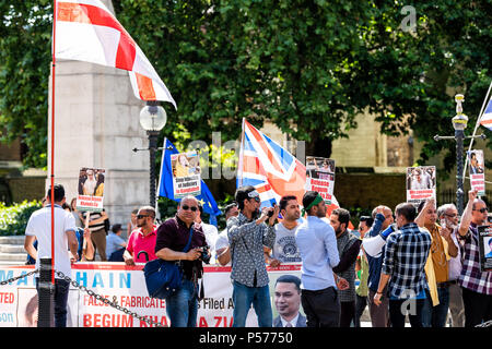London, United Kingdom - June 25, 2018: People standing at Bangladesh protest in UK England by Westminster with signs for releasing Begum Khaleda Zia, former Nationalist Party leader, flags Credit: Kristina Blokhin/Alamy Live News Stock Photo