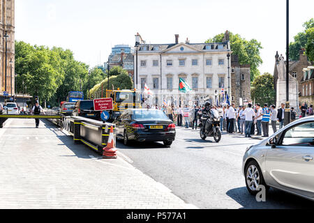 London, United Kingdom - June 25, 2018: People, men at Bangladesh protest in UK, England by Westminster Palace, signs, flags, police officers security guards Credit: Andriy Blokhin/Alamy Live News Stock Photo