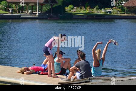 American girl crew relax on the pontoon on scorcher of a hot day after  practicing on the River Thames for the forthcoming Henley Royal Regatta starting 4th — 8th July   for the third most important event in the English social sporting calendar. Stock Photo