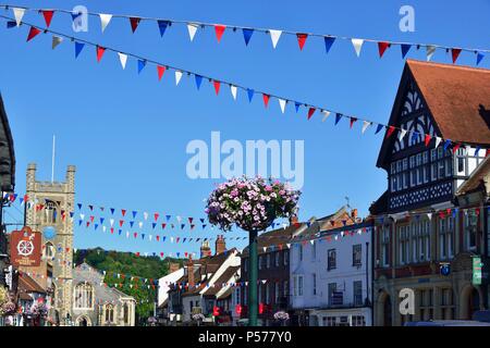 Hart Street in the town of Henley-on-Thames hangs out the bunting and prepares itself  for the  Henley Royal  Regatta starting 4th — 8th July for the third most important event in the English social sporting  calendar. St Mary's Church in the background - England, UK Stock Photo
