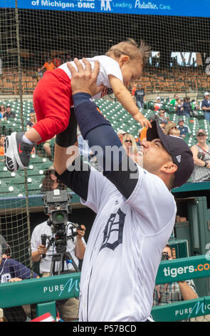 Detroit, Michigan USA - 25 June 2018 - Detroit Tigers shortstop Jose Iglesias holds up his son, Alvaro Jose, before being sworn in as new U.S. citizen in a ceremony at Comerica Park before a Tigers baseball game. Credit: Jim West/Alamy Live News Stock Photo