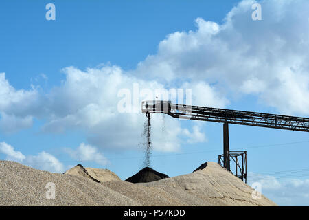 Mountains of sand and gravel in a gravel pit Stock Photo