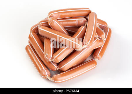 Boiled sausages in a bunch, isolated on a white background. Fresh and tasty. Stock Photo