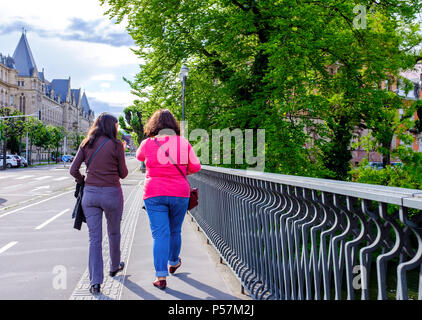 Strasbourg, rear view of 2 women walking on bridge, Alsace, France, Europe, Stock Photo