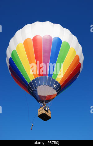 Colorful hot air balloon  in a blue sky. Stock Photo