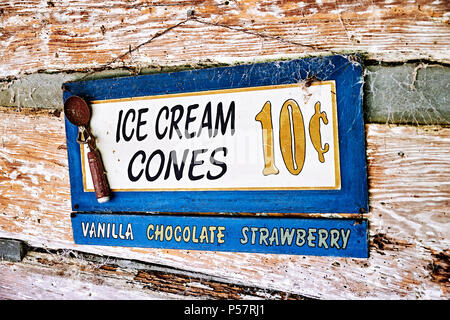 Vintage or antique advertising sign for ice cream cones in three flavors. Stock Photo
