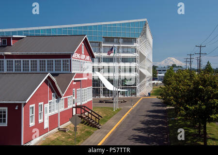 The 'Red Barn” Boeing's original factory building, Museum of Flight (rear) and Mt. Rainier, at Boeing Field, Washington. Stock Photo