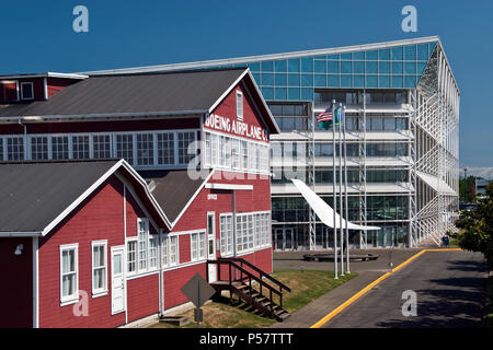 The 'Red Barn” (built 1909) was Boeing's original factory building, with the Museum of Flight (rear) at Boeing Field, Washington. Stock Photo