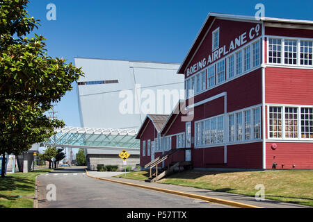 The 'Red Barn” (built 1909) was Boeing's original factory building, with the Museum of Flight (rear) at Boeing Field, Washington. Stock Photo