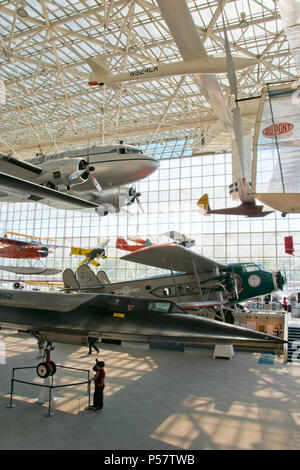 A 1940 Douglas DC-3 airliner hangs above a Lockheed M-21 Blackbird at ...