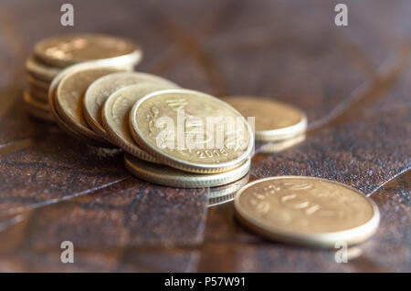 A pile of Rupees Five coins of the Indian Currency made out of copper or bronze Stock Photo