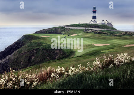 Old Head Golf Course on a calm day with the old lighthouse on the cliff top Stock Photo