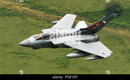 RAF Tornado (RAF 100 Special) flying low level in the mach loop area of Wales (LFA7, low flying area 7) near Snowdonia Stock Photo