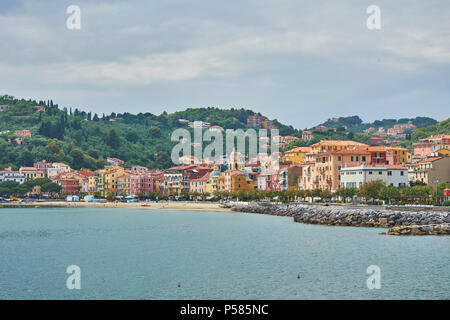 Old Classic Colorful Facade Building With Church And Beach San Terenzo, Lerici, Liguria, Italy Stock Photo