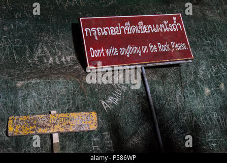 don't write anything on rock sign, next to text written on the rock ...