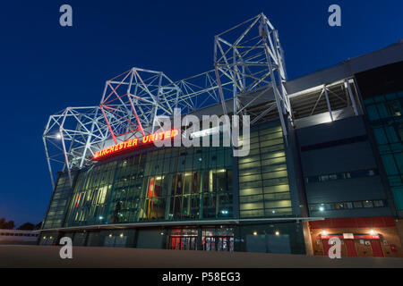 Old Trafford stadium, home of Manchester United Football Club, during a summer's evening (Editorial use only). Stock Photo