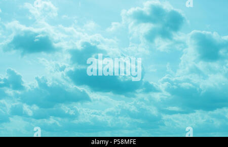 Despite dark clouds, on the blue sky  sun shines. Stock Photo