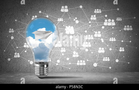 Lightbulb with flying paper plane and clouds inside placed against sketched social network system on wall. 3D rendering. Stock Photo