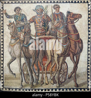 Quadriga depicted in the circus scene in the Roman mosaic from the 3rd century AD on display in the National Archaeological Museum (Museo Arqueológico Nacional) in Madrid, Spain. The driver of the red team (factio russata), winner of the race, has taken the palm frond of victory. He will also take home of large sum of money and numerous gifts from his admirers. And everyone who bet on him will have won thousands of sestertii. Stock Photo