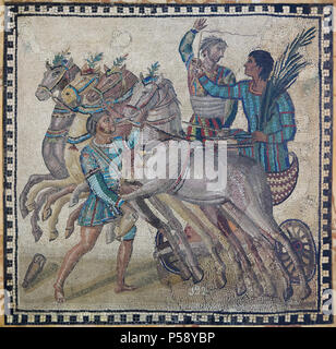 Quadriga depicted in the circus scene in the Roman mosaic from the 3rd century AD on display in the National Archaeological Museum (Museo Arqueológico Nacional) in Madrid, Spain. The blue team (factio veneta) has won the race. Their driver completes a celebratory lap holding the palm frond of victory in his hand. The iubilator hails the victor and the sparsor prepares to water the horses. Stock Photo