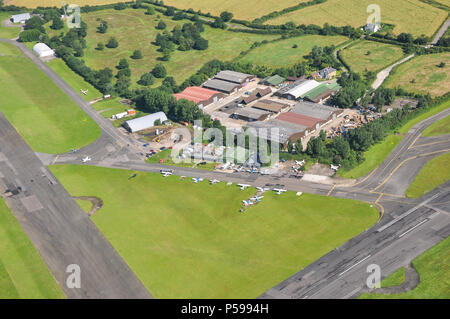 North Weald airfield aerial photograph. The Squadron cafe restaurant, hangars, aircraft and taxiways. Essex, UK. Second World War historic aerodrome Stock Photo