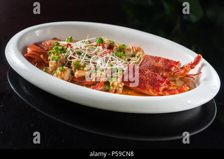 Steamed lobster with rice noodles and garlic Stock Photo
