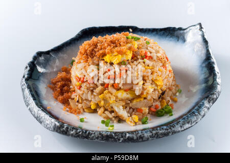 chinese cuisine, salt salmon fish and egg fried rice on white background Stock Photo