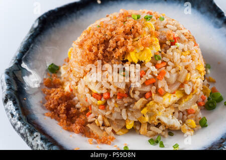chinese cuisine, salt salmon fish and egg fried rice on white background Stock Photo