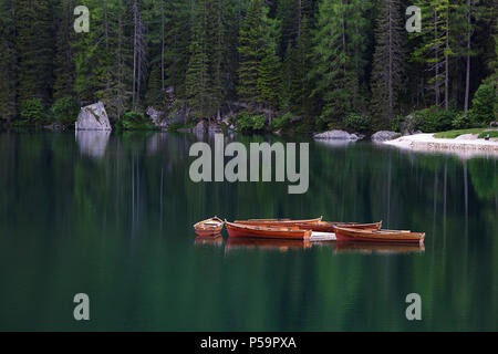 Wooden boats on an alpine lake Stock Photo