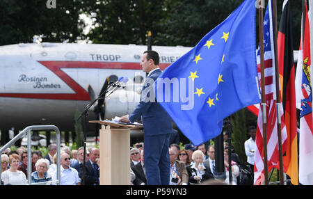 Frankfurt am Main, Germany. 26th June, 2018. Richard Grenell, American ambassador to Germany holds a speech during the 70th jubilee of the Berlin air bridge at the memorial site at the Frankfurt Airport. The air bridge served as the supply of West Berlin through the western Allies during the Berlin blockade through the soviet occupation force from the 24th of June 1948 until the 12th of May 1949. Credit: Arne Dedert/dpa/Alamy Live News  Stock Photo