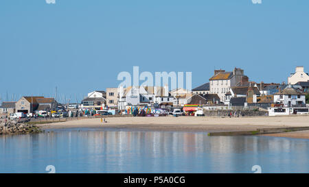 Lyme Regis, Dorset, UK. 26th June 2018. UK Weather: Hot and sunny morning in Lyme Regis. A calm scene on the beach before the crowds arrive to enjoy the sun on the hottest day of the year so far. Credit: Celia McMahon/Alamy Live News. Stock Photo