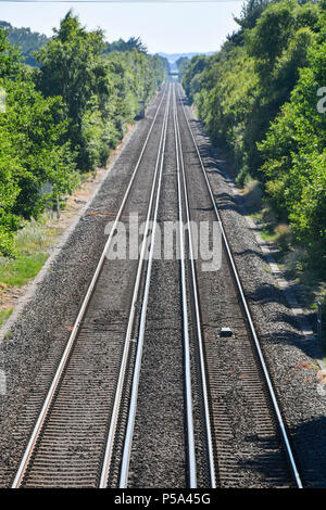 Holton Heath Station, Dorset, UK.  26th June 2018. UK Weather.   Delays on South Western Railways in Dorset after a small fire under a train between Surbiton and Weybridge blocked the West bound line.  This incident is on top of the speed restrictions on the railways due to the risk of the lines buckling due to the hot temperatures from the current heatwave.  Picture Credit: Graham Hunt/Alamy Live News Stock Photo