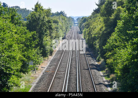 Holton Heath Station, Dorset, UK.  26th June 2018. UK Weather.   Delays on South Western Railways in Dorset after a small fire under a train between Surbiton and Weybridge blocked the West bound line.  This incident is on top of the speed restrictions on the railways due to the risk of the lines buckling due to the hot temperatures from the current heatwave.  Picture Credit: Graham Hunt/Alamy Live News Stock Photo