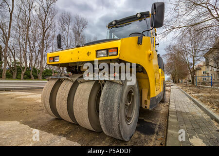 Close view on the road roller. Street paving works Stock Photo