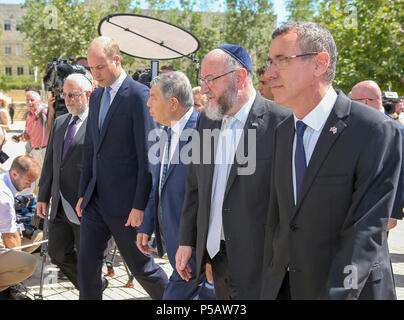 RETRANSMISSION, CORRECTING NAME OF CHIEF RABBI. The Duke of Cambridge (second left) and Ephraim Mirvis (second right), chief rabbi in the UK, arriving at the Yad Vashem Holocaust Memorial and Museum in Jerusalem, Israel's official memorial to the Jewish victims of the Holocaust, as part of his tour of the Middle East. Stock Photo