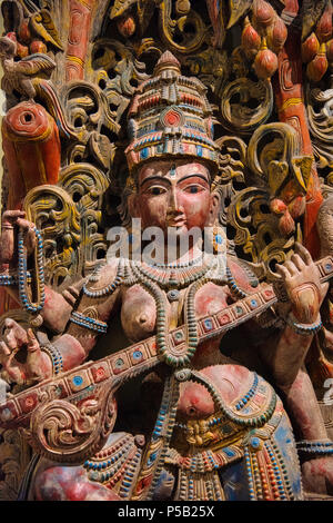 Wooden idol of Goddess Saraswati, Egmore, Chennai, India. Located at the Government Museum or Madras Museum Stock Photo