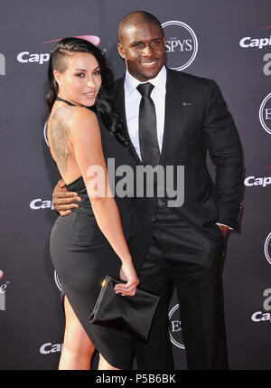 Reggie Bush, Lilit Avagyan  at the ESPY 2013 Awards at the Nokia Theatre In Los Angeles.Reggie Bush, Lilit Avagyan 253 ------------- Red Carpet Event, Vertical, USA, Film Industry, Celebrities,  Photography, Bestof, Arts Culture and Entertainment, Topix Celebrities fashion /  Vertical, Best of, Event in Hollywood Life - California,  Red Carpet and backstage, USA, Film Industry, Celebrities,  movie celebrities, TV celebrities, Music celebrities, Photography, Bestof, Arts Culture and Entertainment,  Topix, vertical,  family from from the year , 2013, inquiry tsuni@Gamma-USA.com Husband and wife Stock Photo