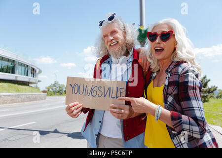 Joyful delighted couple going to youngsville Stock Photo