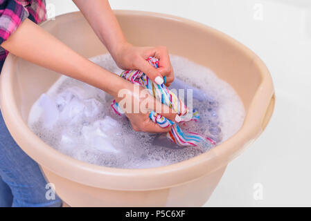 Women separate cloth from basket into the basin , hand wash Stock Photo by  ©dream5_5_5@hotmail.com 317932068