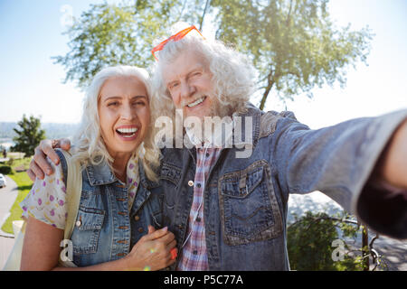Happy elderly couple taking selfies Stock Photo